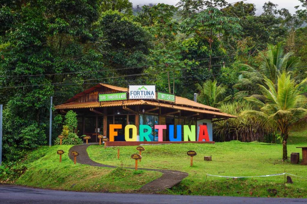 Colorful Fortuna sign in front of tour center, La Fortuna Costa Rica