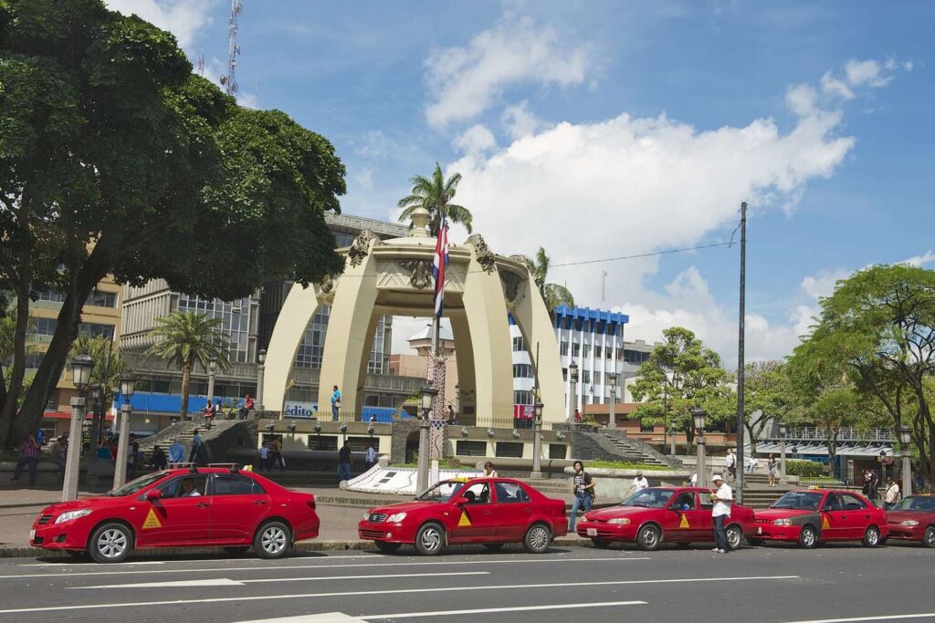 Red taxis parked near Plaza de la Cultura in San José