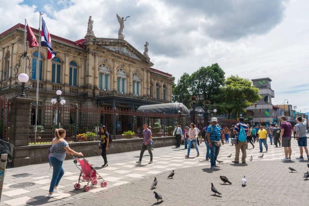 Tourists outside the National Theatre of Costa Rica, San José.