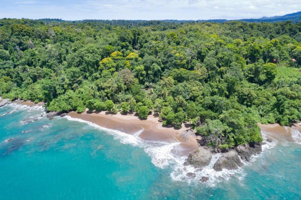 Tropical beach Playa San Josecito at Osa Peninsula with jungle coastline in Costa Rica