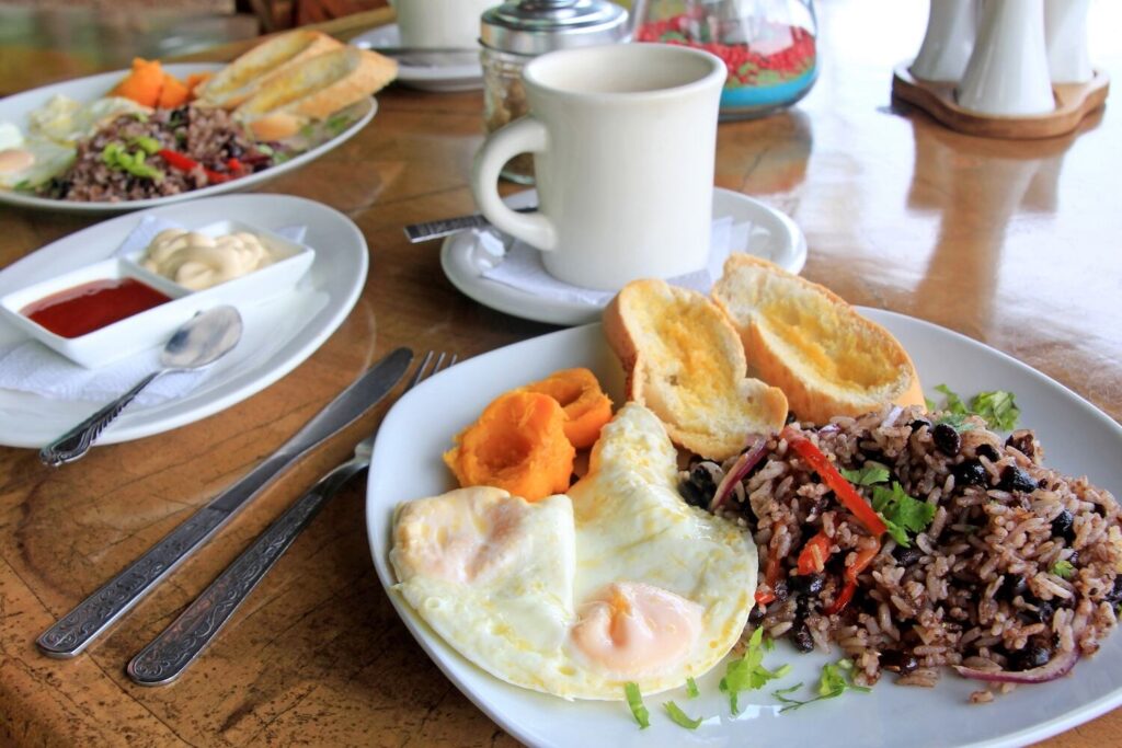 Costa Rican breakfast with eggs, rice, and plantains.