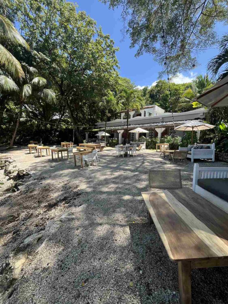 Beachfront seating and umbrellas at La Luna