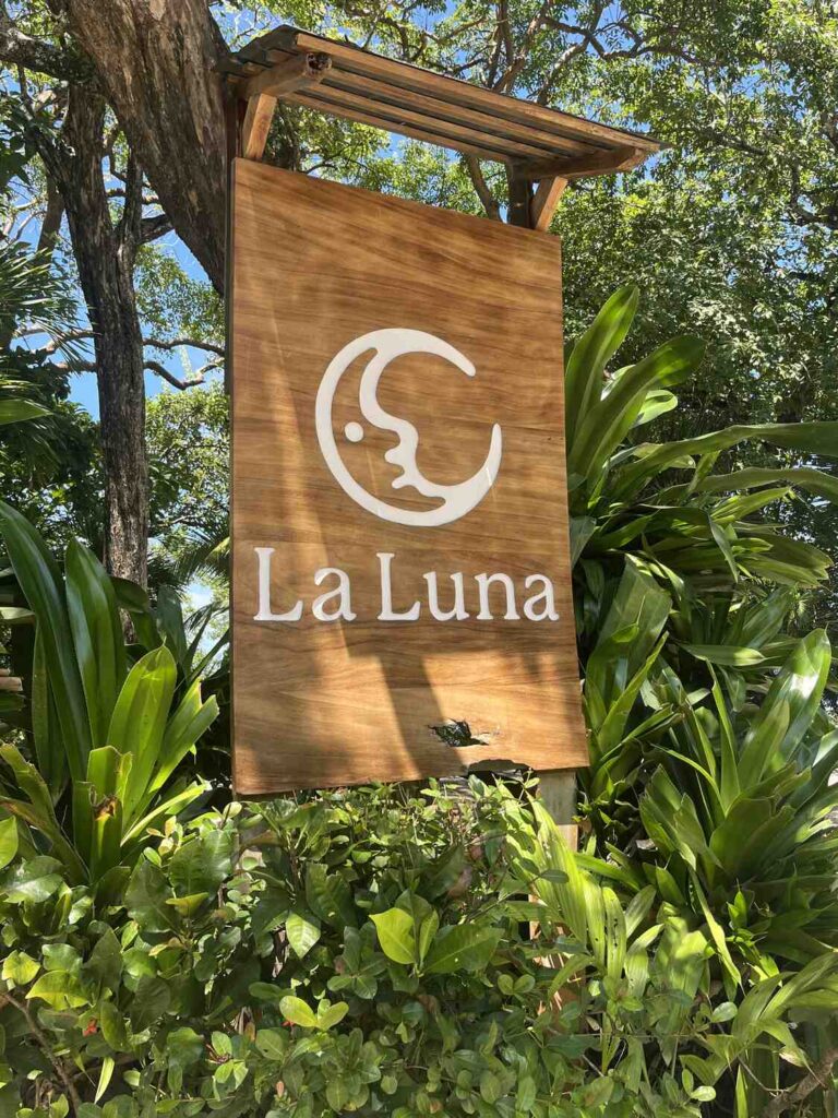 Wooden La Luna sign at the entrance